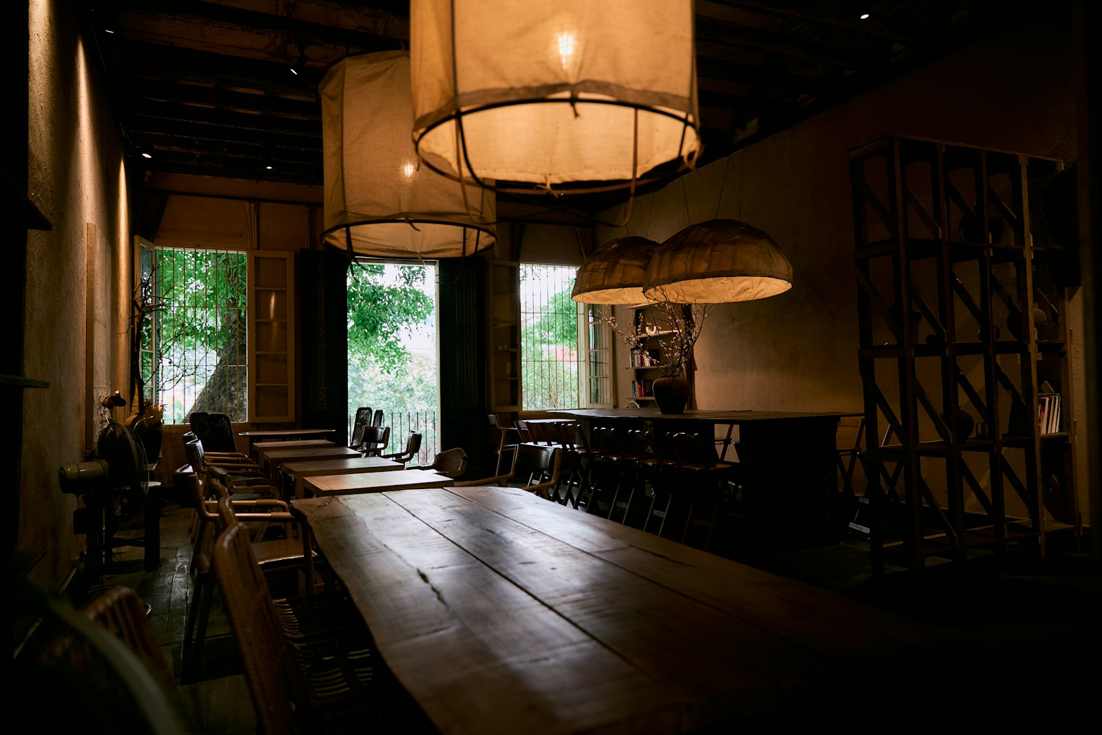 Warm, wood-toned dining room with low lighting