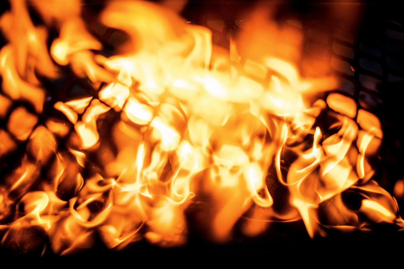 Glowing charcoal in a robata-style grill