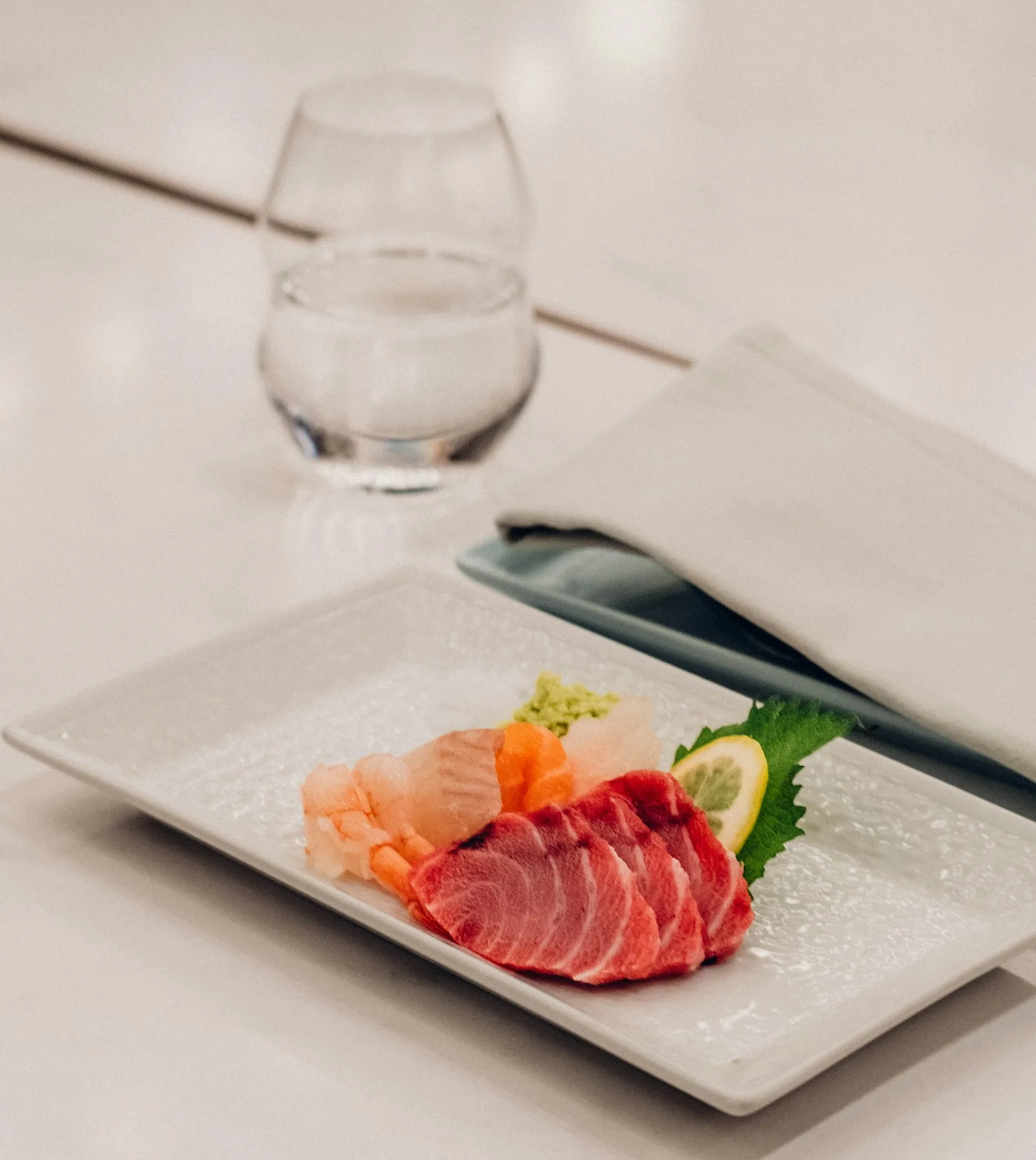 Sliced sashimi platter with tuna, salmon and garnish